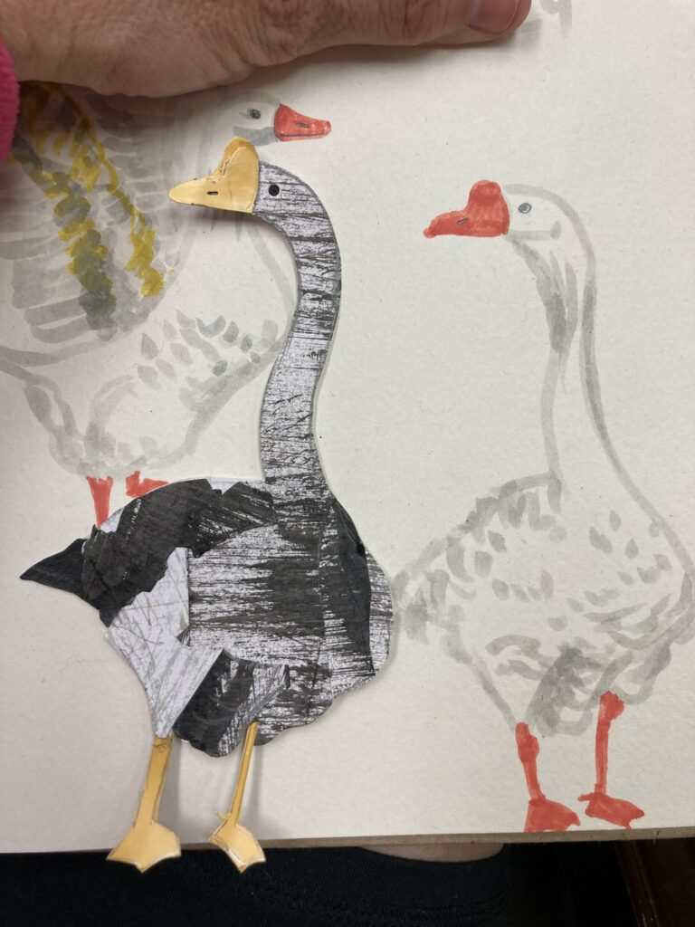 goose i made from cut paper next to the original drawing, made in the deans office waiting for a friend